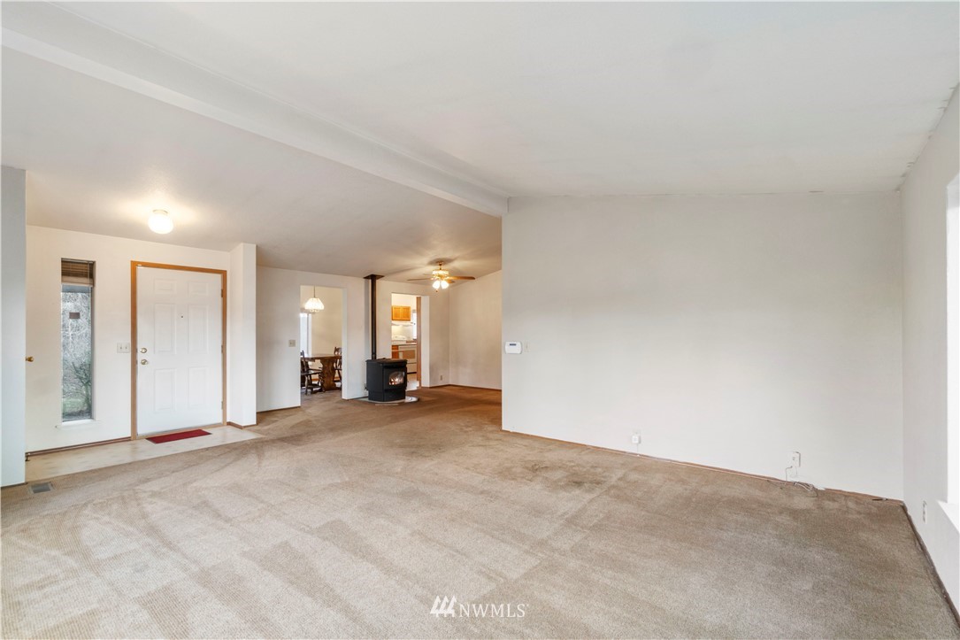 6023 188th Avenue Southwest Rochester, WA 98579 - Photo 7 of 30 an empty room with closet and large windows