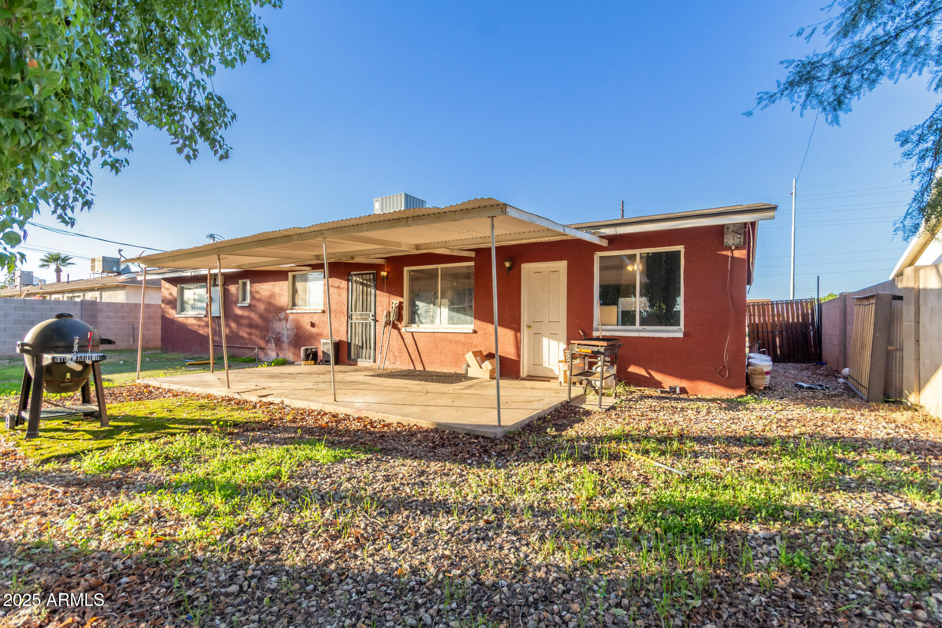 4727 West Osborn Road Phoenix, AZ 85031 - Photo 21 of 22 a view of a house with backyard and sitting area