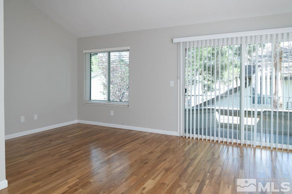 4004 Millbrook Lane Reno, NV 89509 - Photo 10 of 36 a view of an empty room with wooden floor and a window