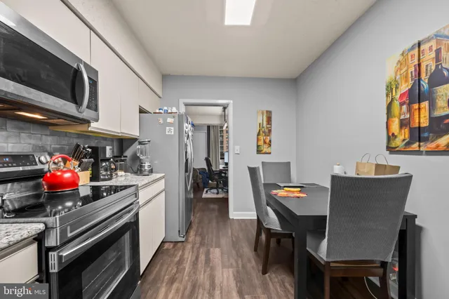 a kitchen with a refrigerator stove and microwave