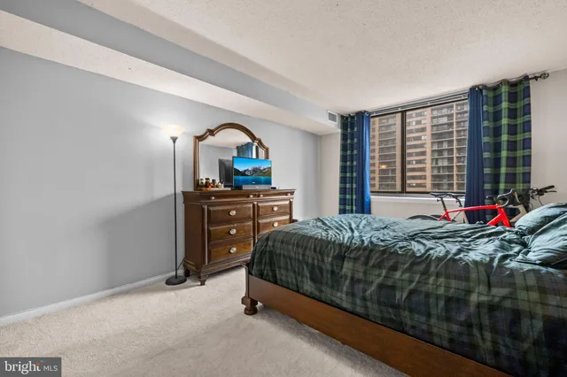 a bedroom with a bed and furniture