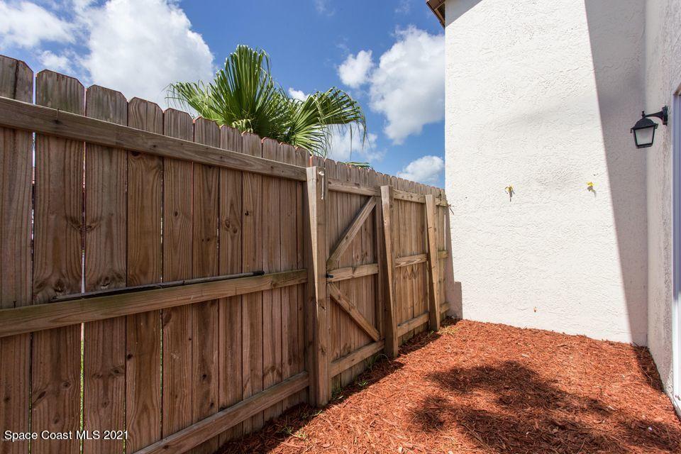 744 Ridge Club Drive, Unit 55 Melbourne, FL 32934 - Photo 15 of 15 a view of wooden fence