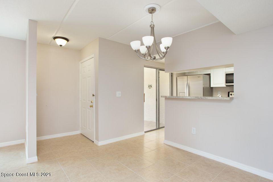 744 Ridge Club Drive, Unit 55 Melbourne, FL 32934 - Photo 4 of 15 a view of a chandelier fan and entryway