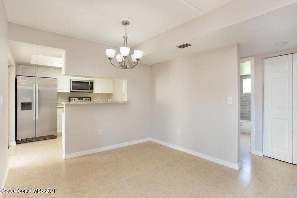 744 Ridge Club Drive, Unit 55 Melbourne, FL 32934 - Photo 5 of 15 a view of a kitchen with a sink and dishwasher