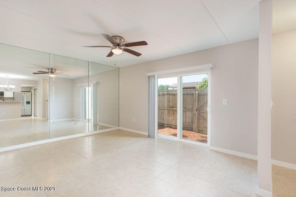 744 Ridge Club Drive, Unit 55 Melbourne, FL 32934 - Photo 6 of 15 an empty room with a empty space and windows