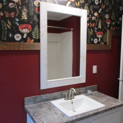 a bathroom with a sink and a mirror
