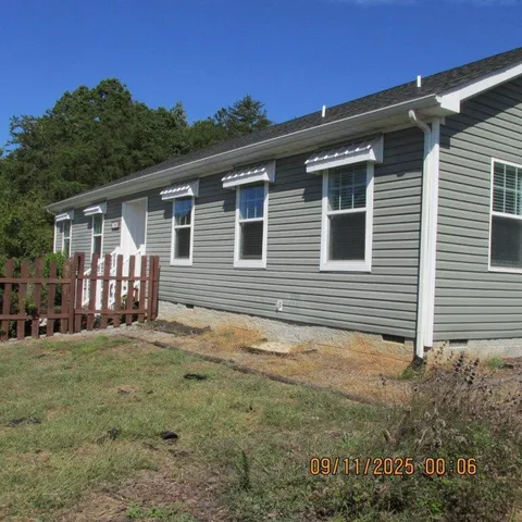 a backyard of a house with seating space