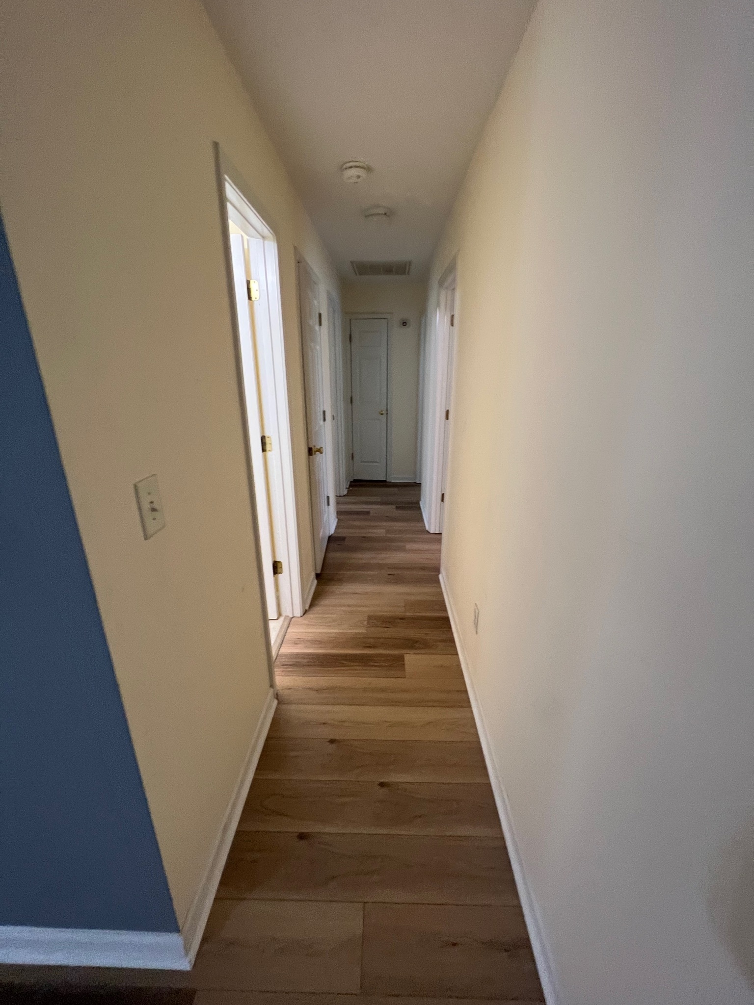 3769 Stagecoach Pass Ellenwood, GA 30294 - Photo 14 of 23 a view of a hallway with wooden floor and staircase