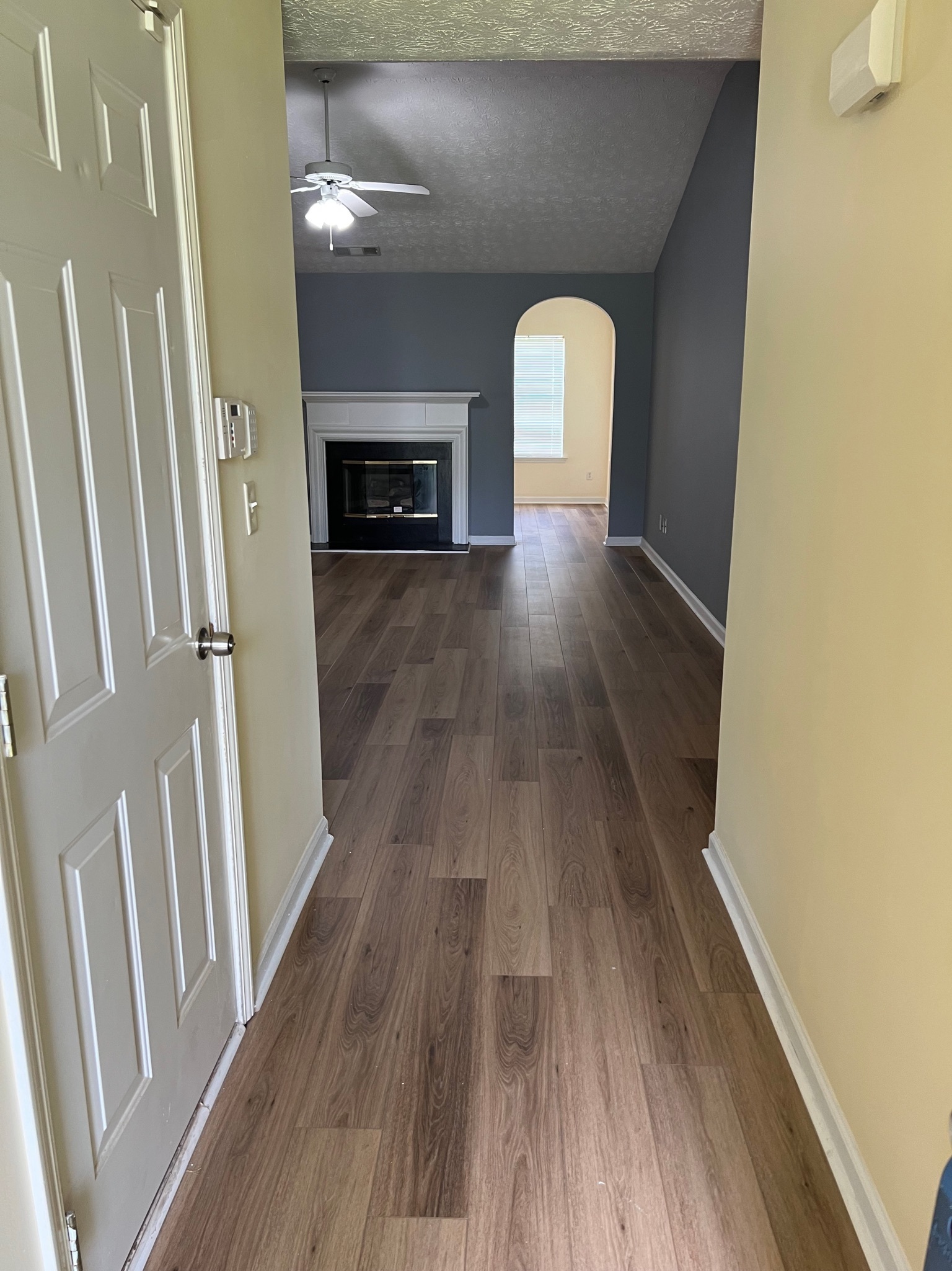 3769 Stagecoach Pass Ellenwood, GA 30294 - Photo 2 of 23 a view of a livingroom with wooden floor and a fireplace