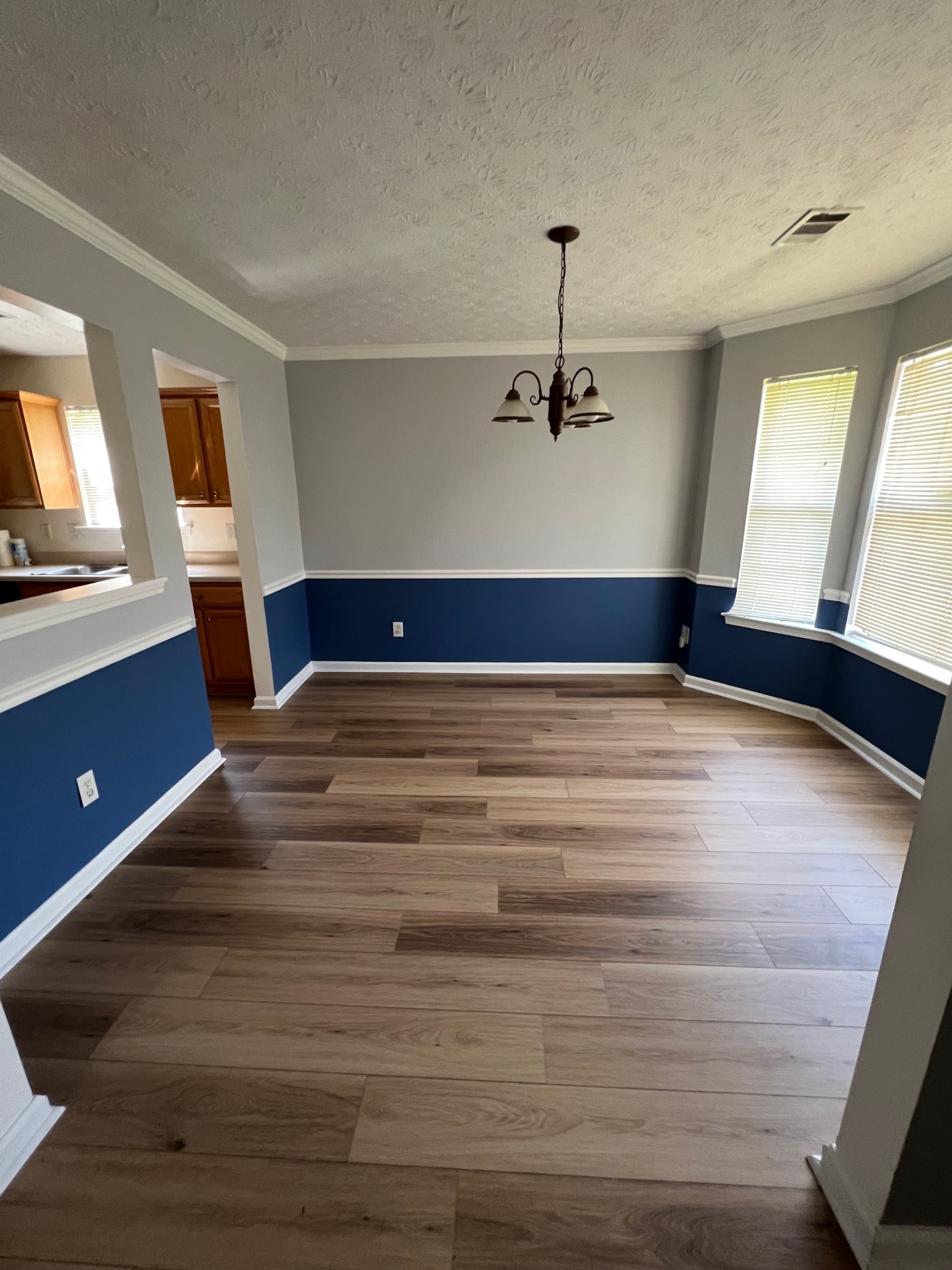 3769 Stagecoach Pass Ellenwood, GA 30294 - Photo 5 of 23 a view of a room with a ceiling fan and wooden floor