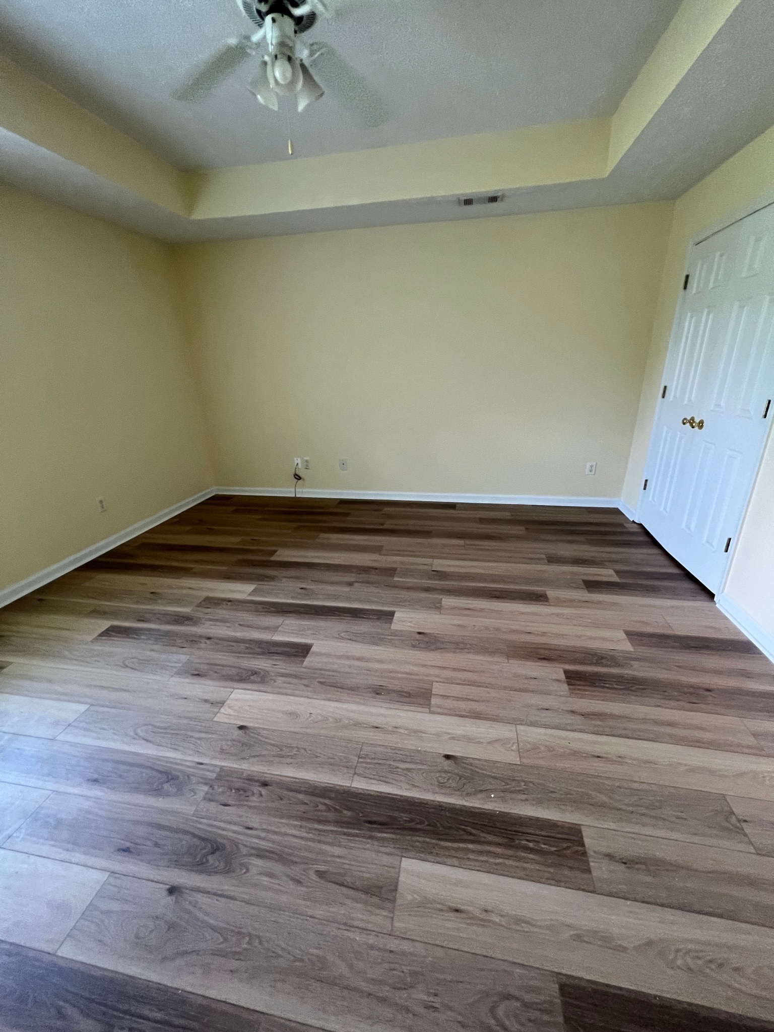 3769 Stagecoach Pass Ellenwood, GA 30294 - Photo 9 of 23 a view of a room with a ceiling fan and wooden floor