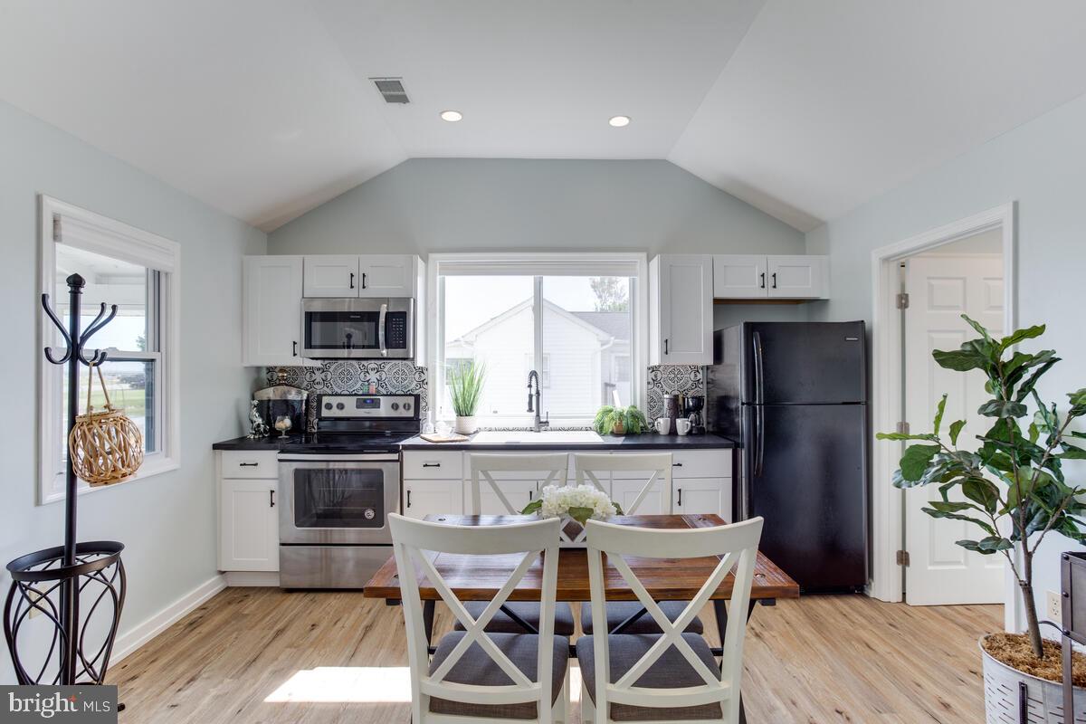 5229 Breezy Point Road Chesapeake Beach, MD 20732 - Photo 18 of 48 Open concept Family room, eating area and Kitchen
