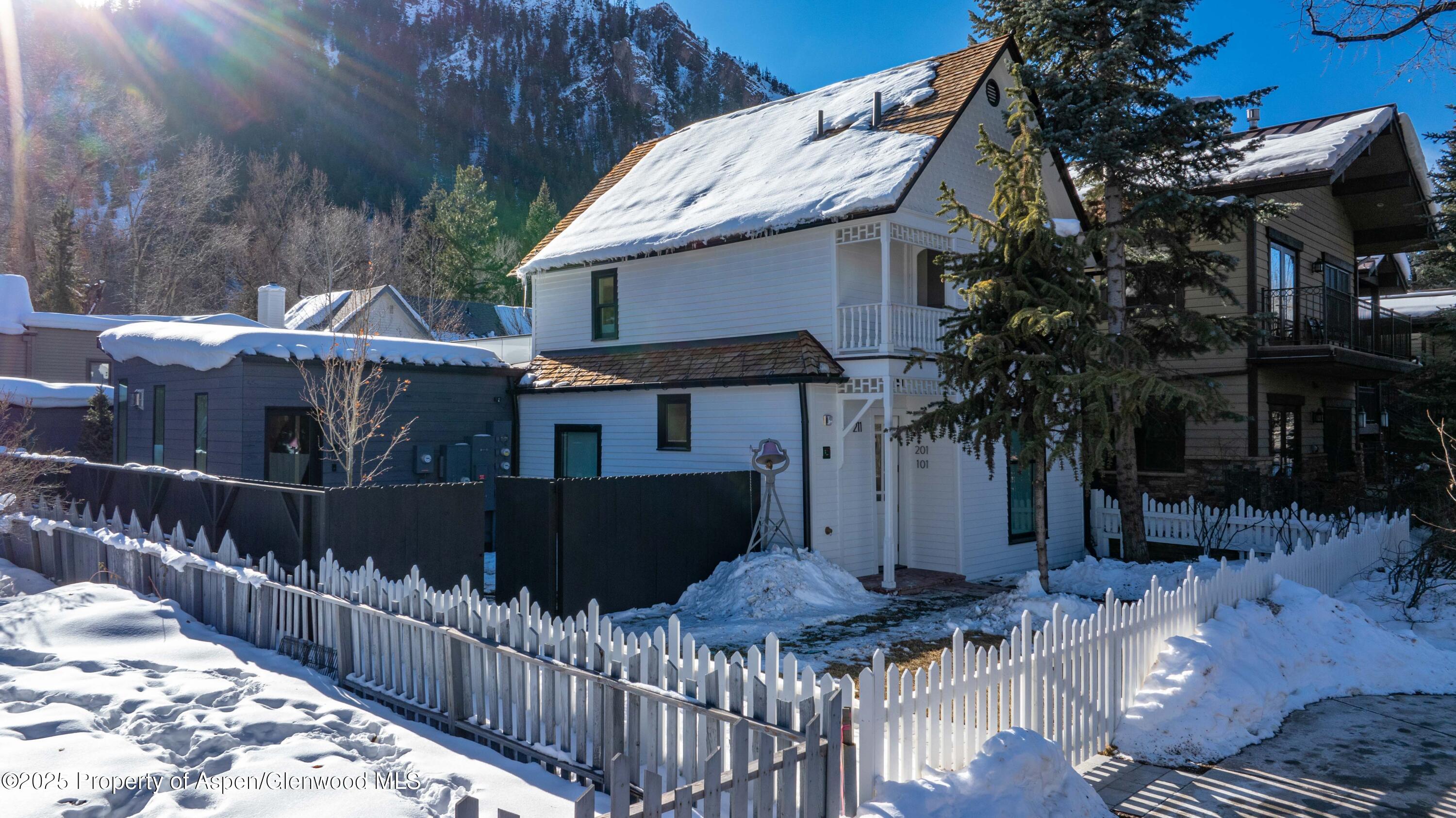 211 West Main Street, Unit 101 Aspen, CO 81611 - Photo 12 of 13 a view of a house with wooden fence
