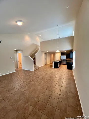 a kitchen with stainless steel appliances kitchen island granite countertop a sink and cabinets