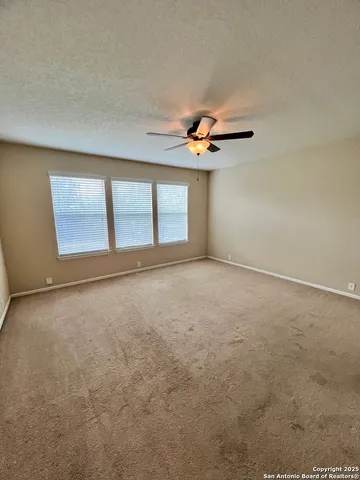 a bathroom with a double vanity sink toilet and a mirror