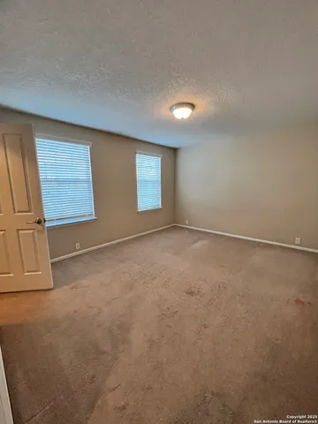 a bathroom with a sink toilet and mirror