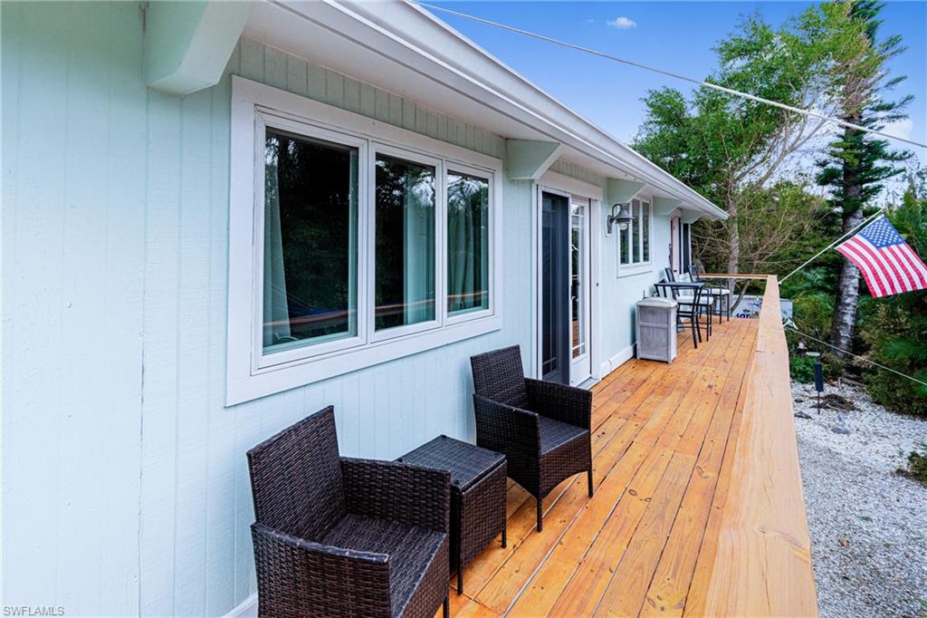 10931 Russell Road Bokeelia, FL 33922 - Photo 23 of 50 a outdoor seating area with furniture