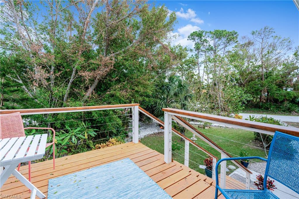 10931 Russell Road Bokeelia, FL 33922 - Photo 4 of 50 a view of balcony with deck and wooden floor