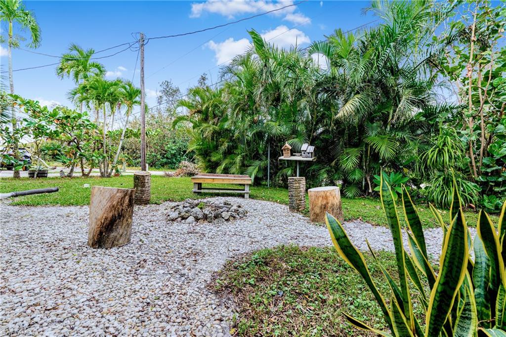 10931 Russell Road Bokeelia, FL 33922 - Photo 44 of 50 a view of a backyard with sitting area