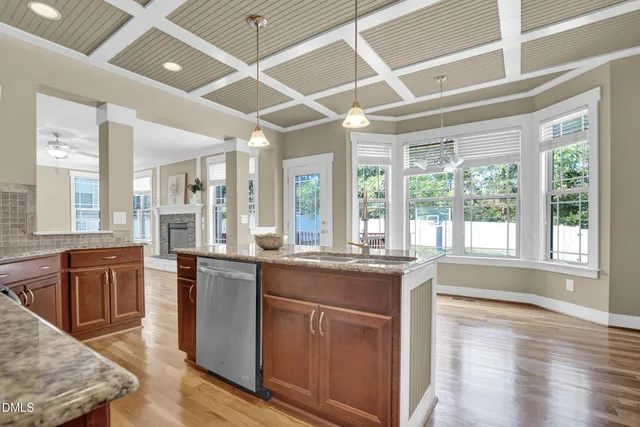 a kitchen with stainless steel appliances granite countertop a stove and a refrigerator
