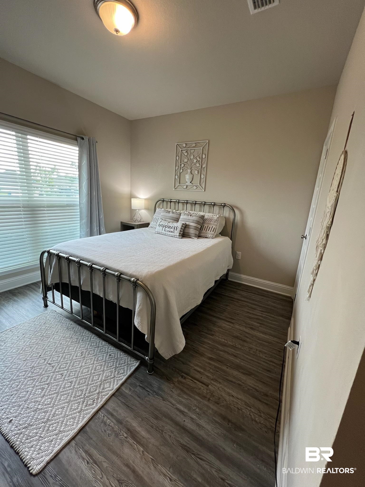 3904 Conrad Court Gulf Shores, AL 36542 - Photo 17 of 24 Bedroom featuring hardwood / wood-style floors