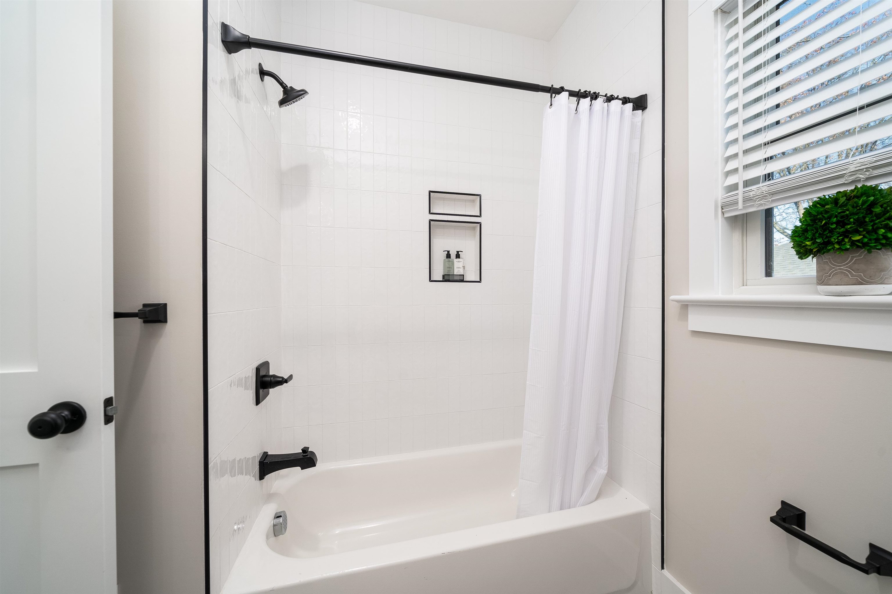 20 Orchard Street, Unit 1 Morristown, NJ 07960 - Photo 12 of 25 a bathroom with a shower and a bath tub