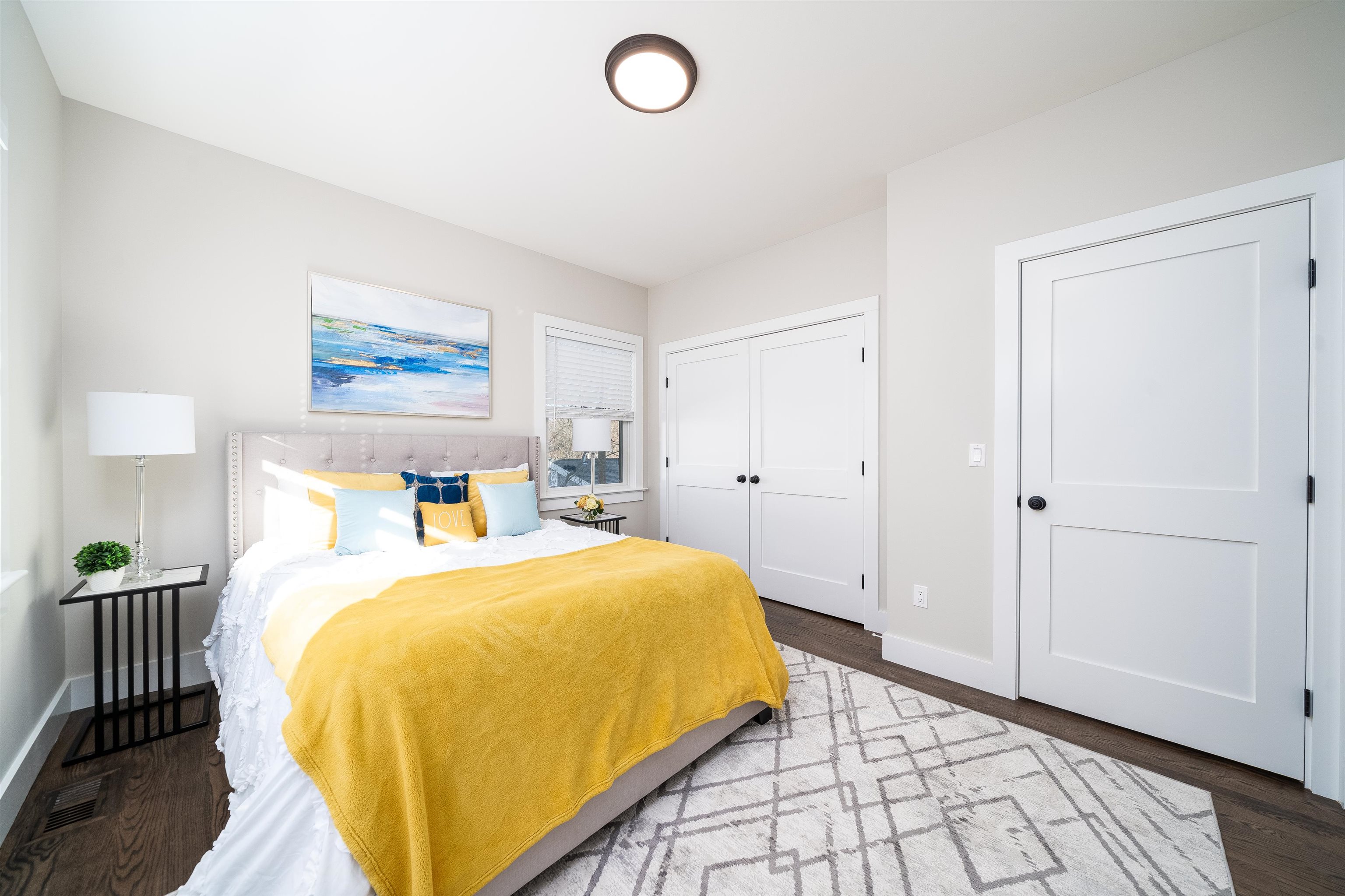 20 Orchard Street, Unit 1 Morristown, NJ 07960 - Photo 15 of 25 a bedroom with a bed and wooden floor