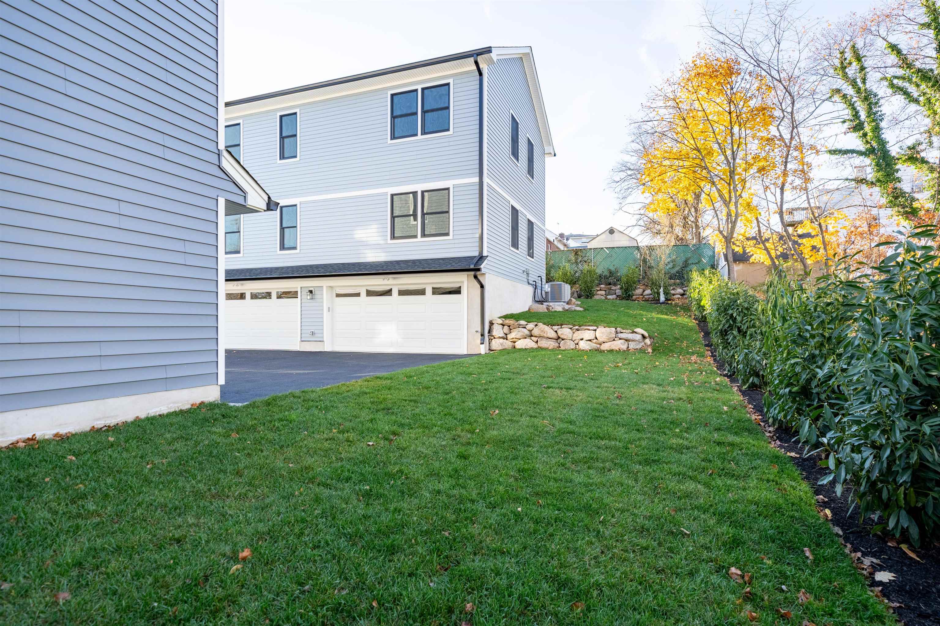 20 Orchard Street, Unit 1 Morristown, NJ 07960 - Photo 23 of 25 a view of a house with a yard