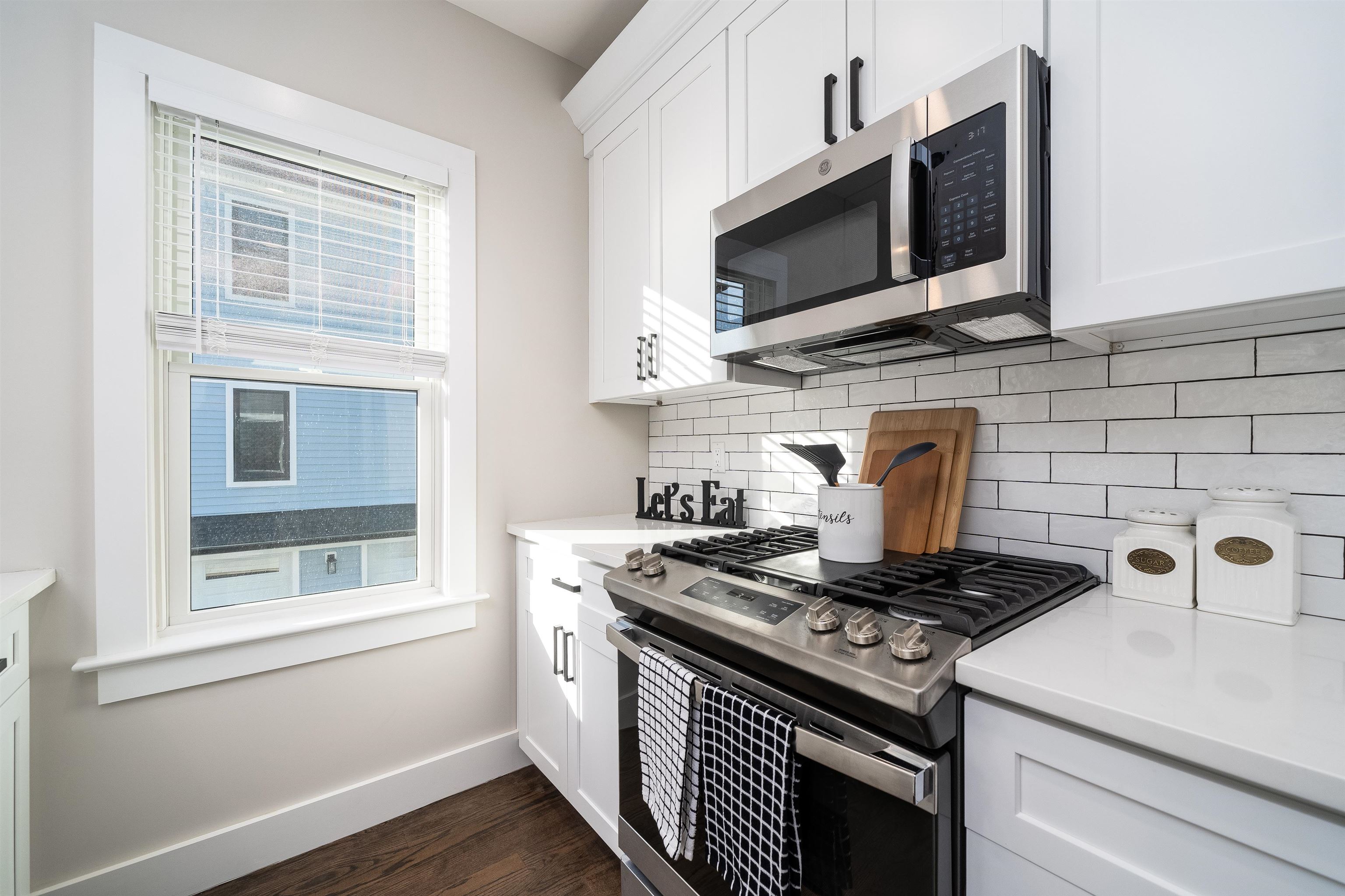 20 Orchard Street, Unit 1 Morristown, NJ 07960 - Photo 9 of 25 a kitchen with stainless steel appliances granite countertop a stove and a microwave