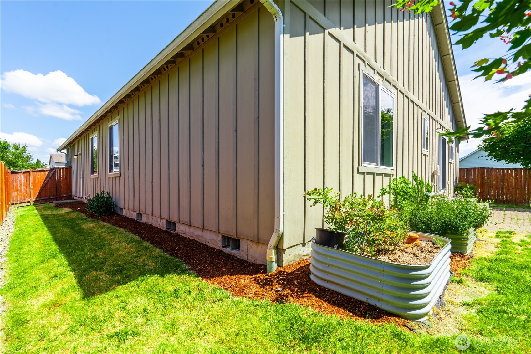 242 Riggs Drive East Enumclaw, WA 98022 - Photo 32 of 40 a house view with a garden space