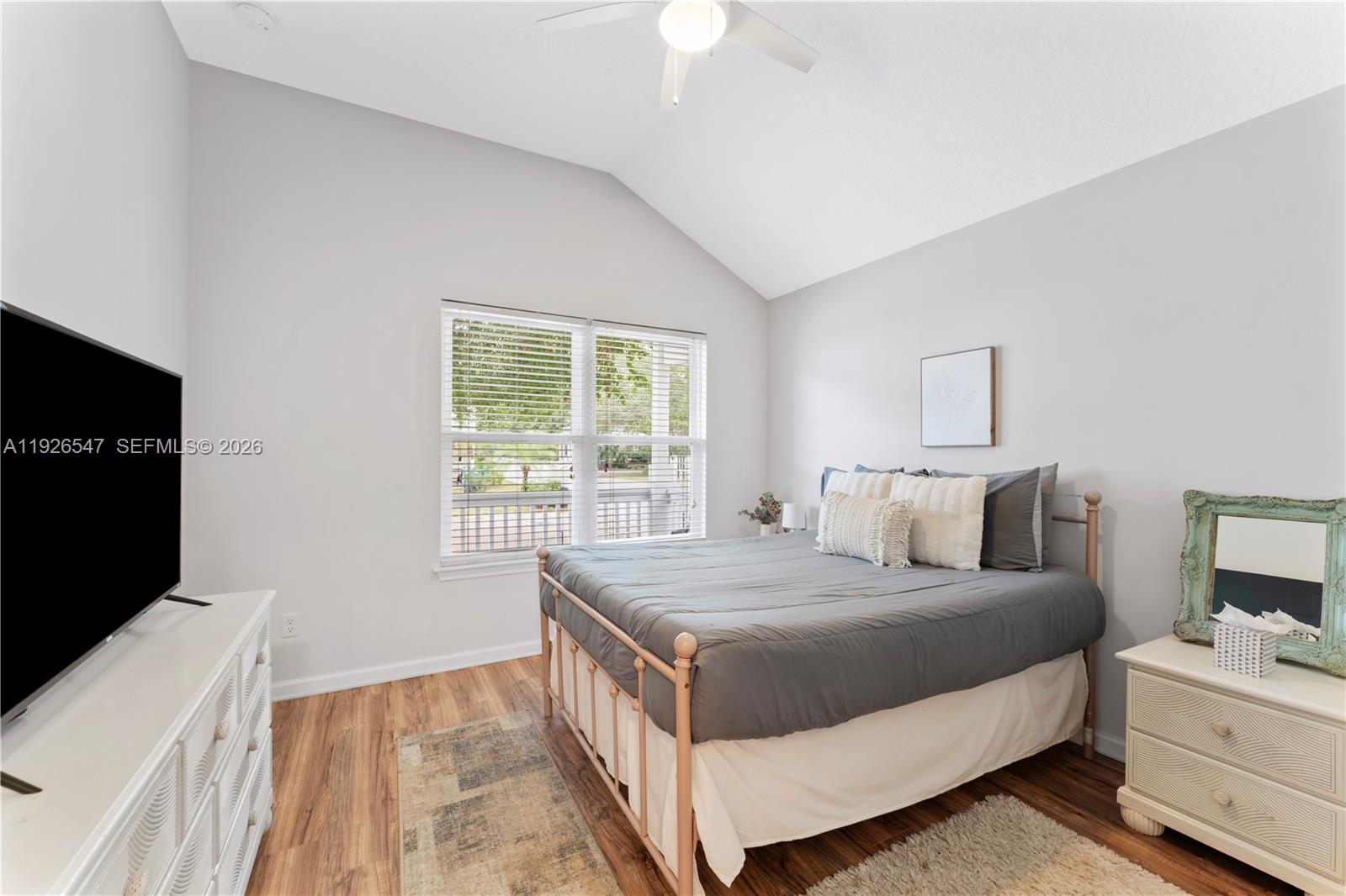 2 Poinciana Cove Road St. Augustine, FL 32084 - Photo 21 of 43 a bedroom with a bed and a flat tv screen on dresser