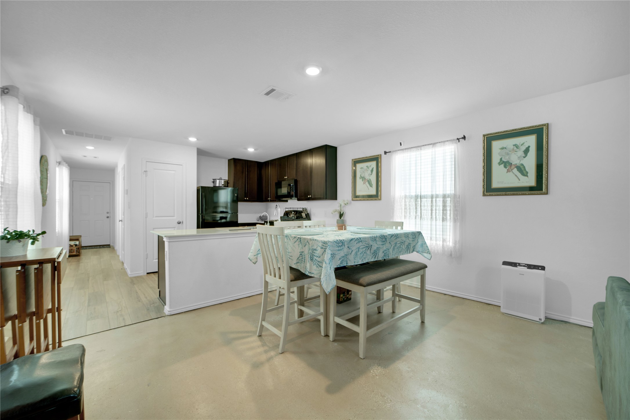 36 Trinity Circle Lockhart, TX 78644 - Photo 6 of 36 a living room with furniture a dining table and kitchen view