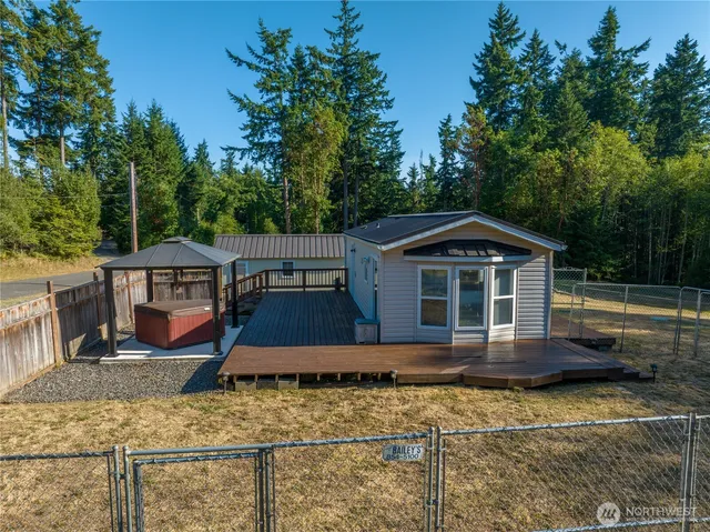 a front view of a house with trees