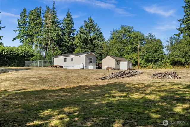 a view of fountain with large trees