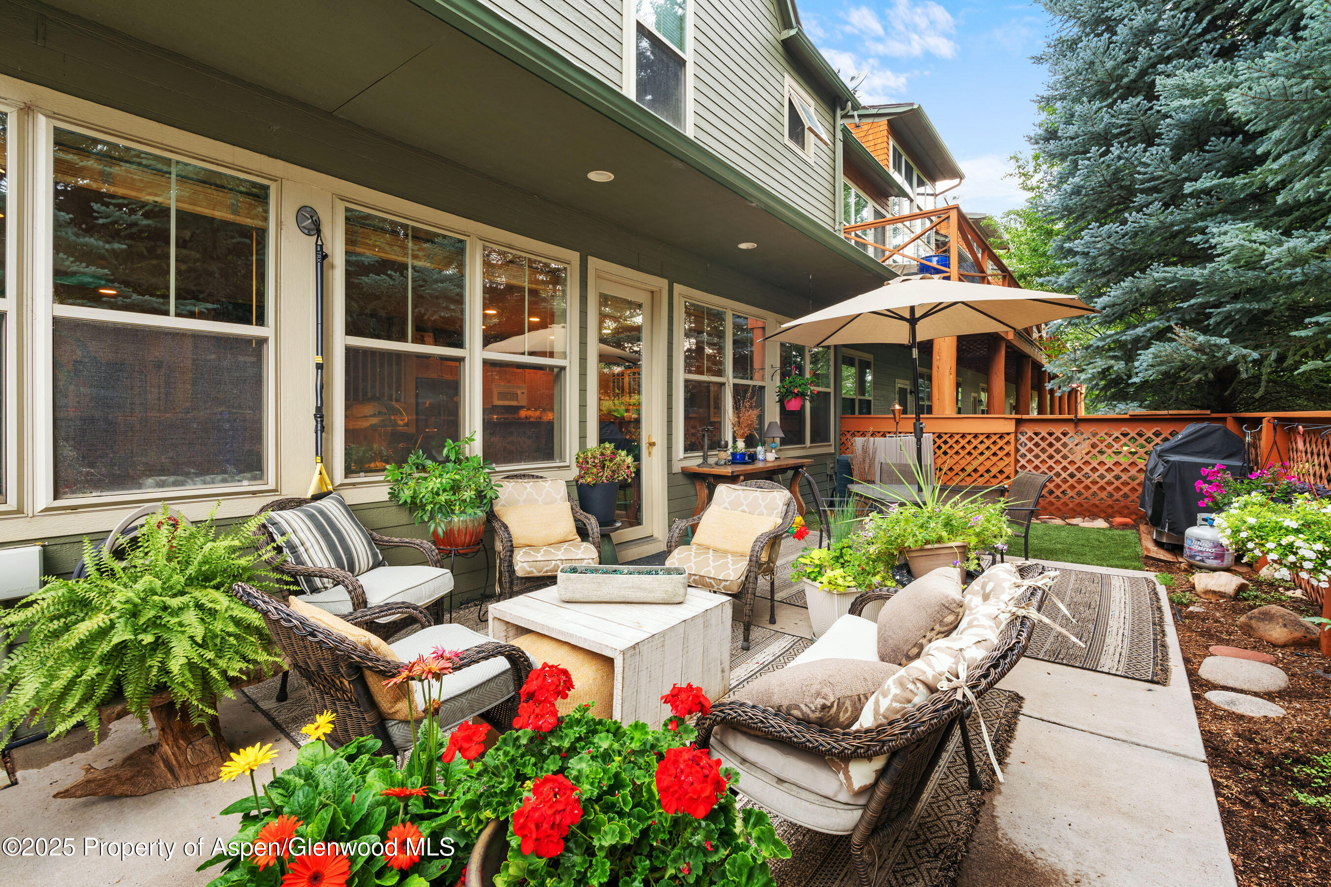 541 Evans Court Basalt, CO 81621 - Photo 11 of 14 a view of a patio with couches table and chairs and potted plants