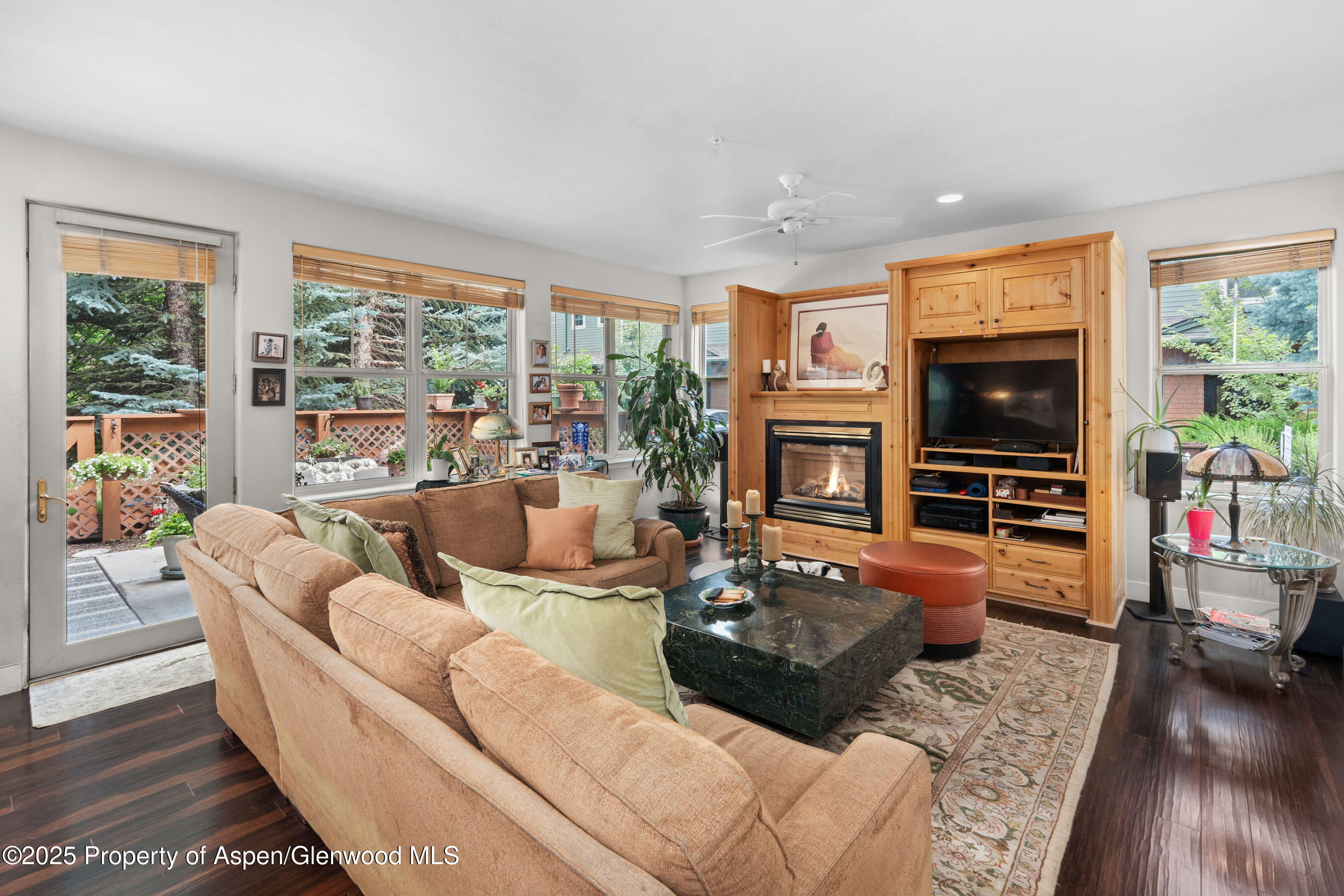 541 Evans Court Basalt, CO 81621 - Photo 3 of 14 a living room with fireplace furniture and a flat screen tv