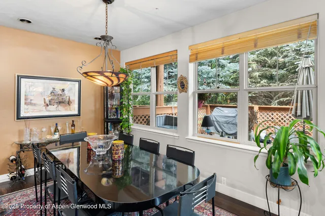 a view of a dining room with furniture window and outside view