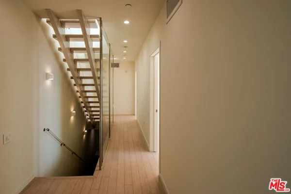 a bathroom with a bathtub a sink and a window