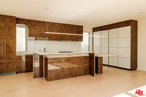 a view of hallway with stairs and wooden floor
