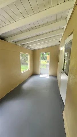 a view of an empty room and window