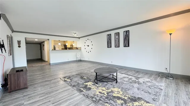 a very nice looking room with wooden floor