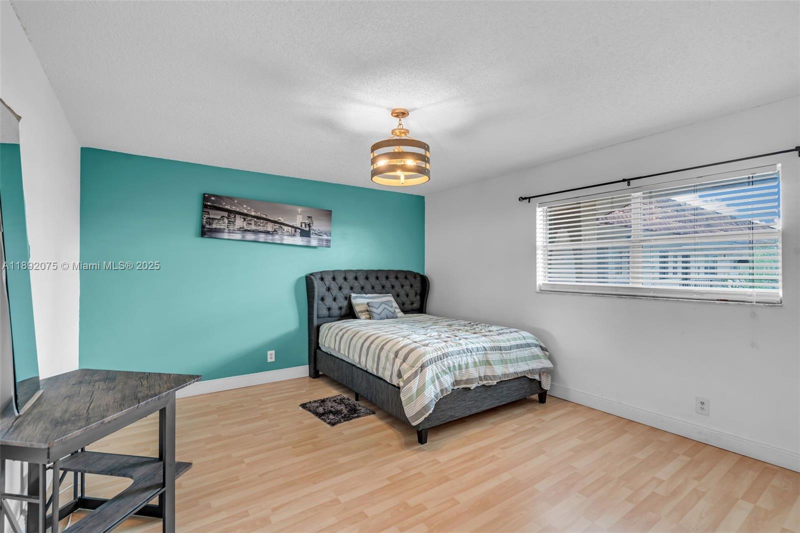 6100 South Falls Cir Drive, Unit 410 Lauderhill, FL 33319 - Photo 14 of 39 a bedroom with a bed and a window