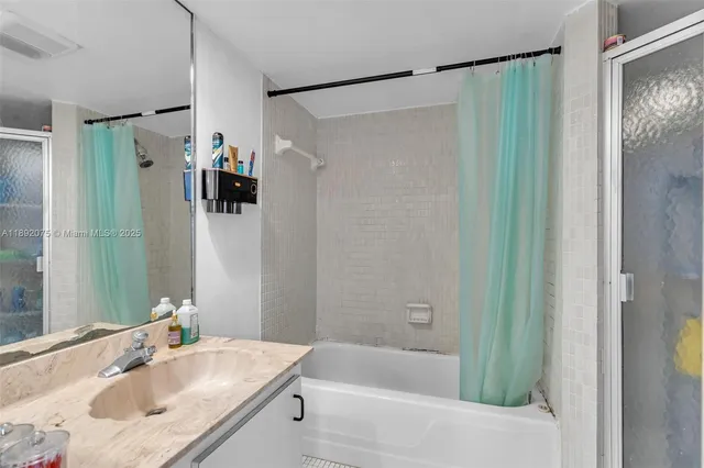 a bathroom with a bathtub and a sink