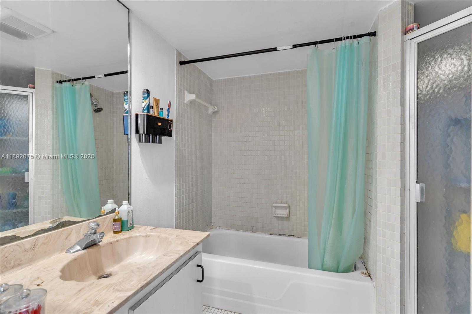 6100 South Falls Cir Drive, Unit 410 Lauderhill, FL 33319 - Photo 20 of 39 a bathroom with a bathtub and a sink