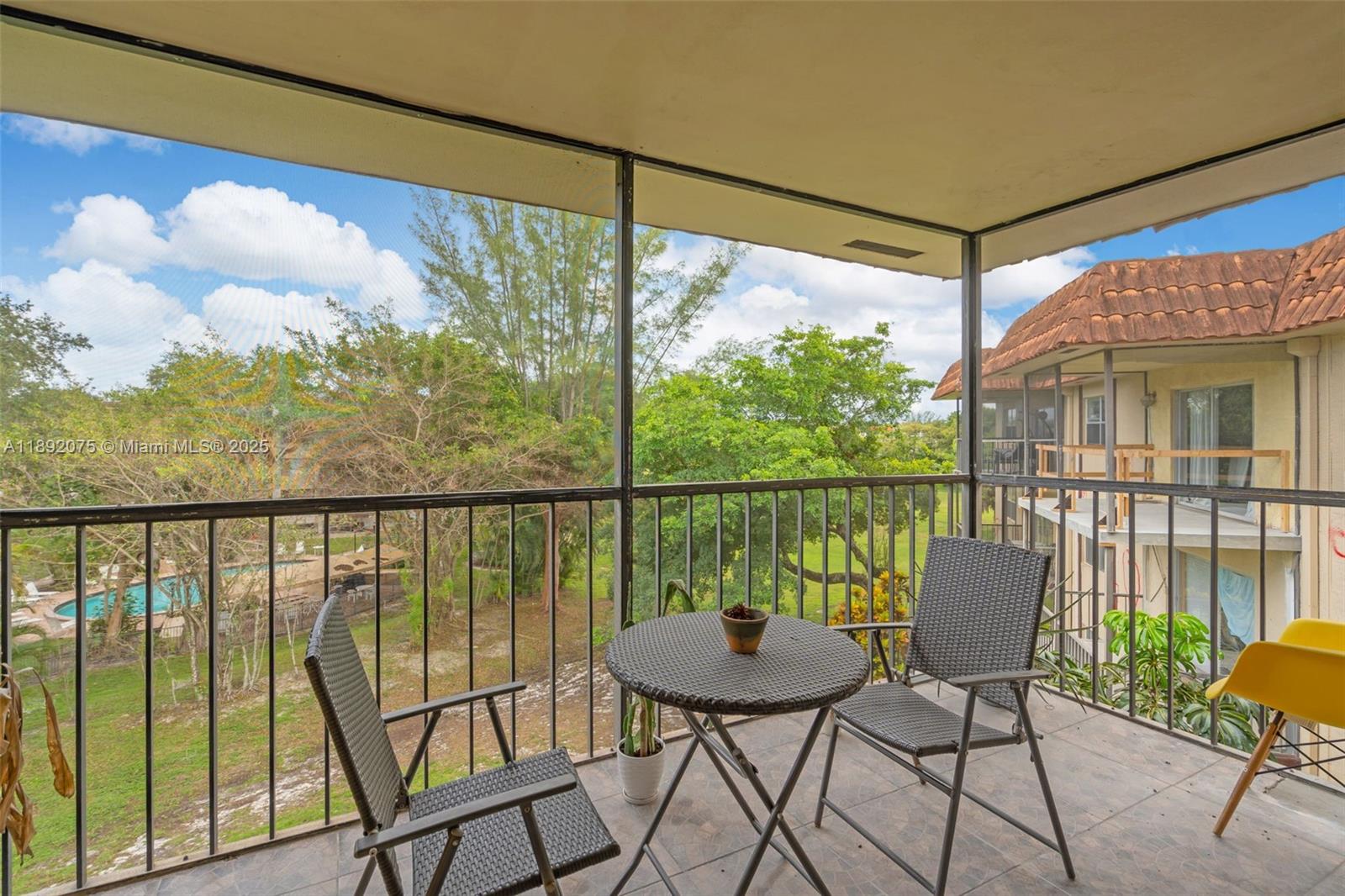 6100 South Falls Cir Drive, Unit 410 Lauderhill, FL 33319 - Photo 23 of 39 a view of a chair and table in the balcony