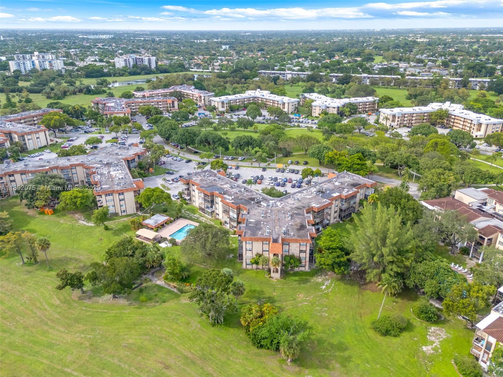 6100 South Falls Cir Drive, Unit 410 Lauderhill, FL 33319 - Photo 35 of 39 an aerial view of residential houses with outdoor space and trees