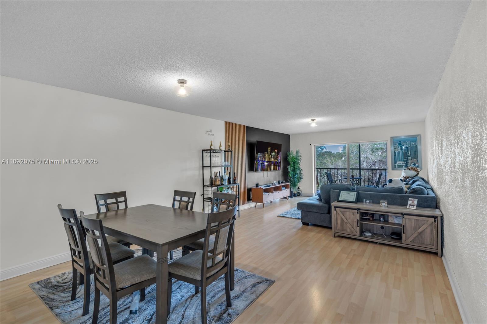 6100 South Falls Cir Drive, Unit 410 Lauderhill, FL 33319 - Photo 6 of 39 a view of a dining room with furniture and wooden floor