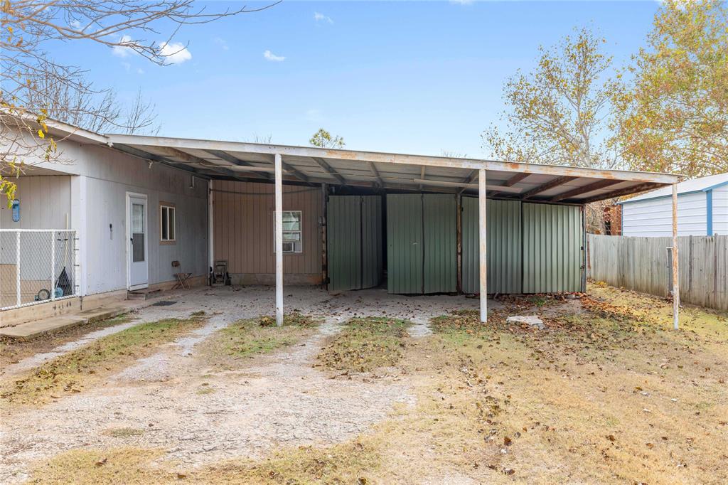 309 Goodwin Street Bangs, TX 76823 - Photo 20 of 20 Back of property featuring a carport