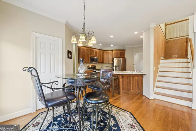 a bedroom with a bed and a mirror on dresser