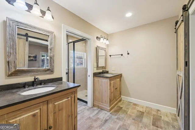 a view of bathroom with a sink and washer dryer